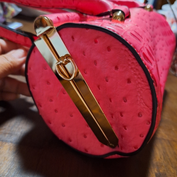 Ruby is a unique handbag that is made of faux leather.  She has a center jeweled - Picture 2 of 7